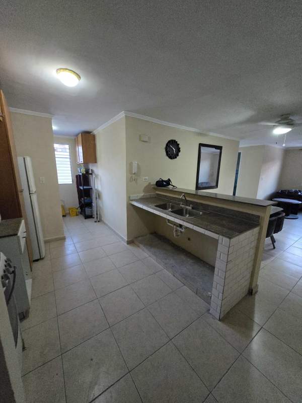 Kitchen with fridge stove microwave in apartment Rio Abajo Panama City