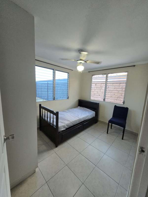 Bedroom with ceiling fan, tile floors and window blinds in PH Samantha Towers Rio Abajo Panama
