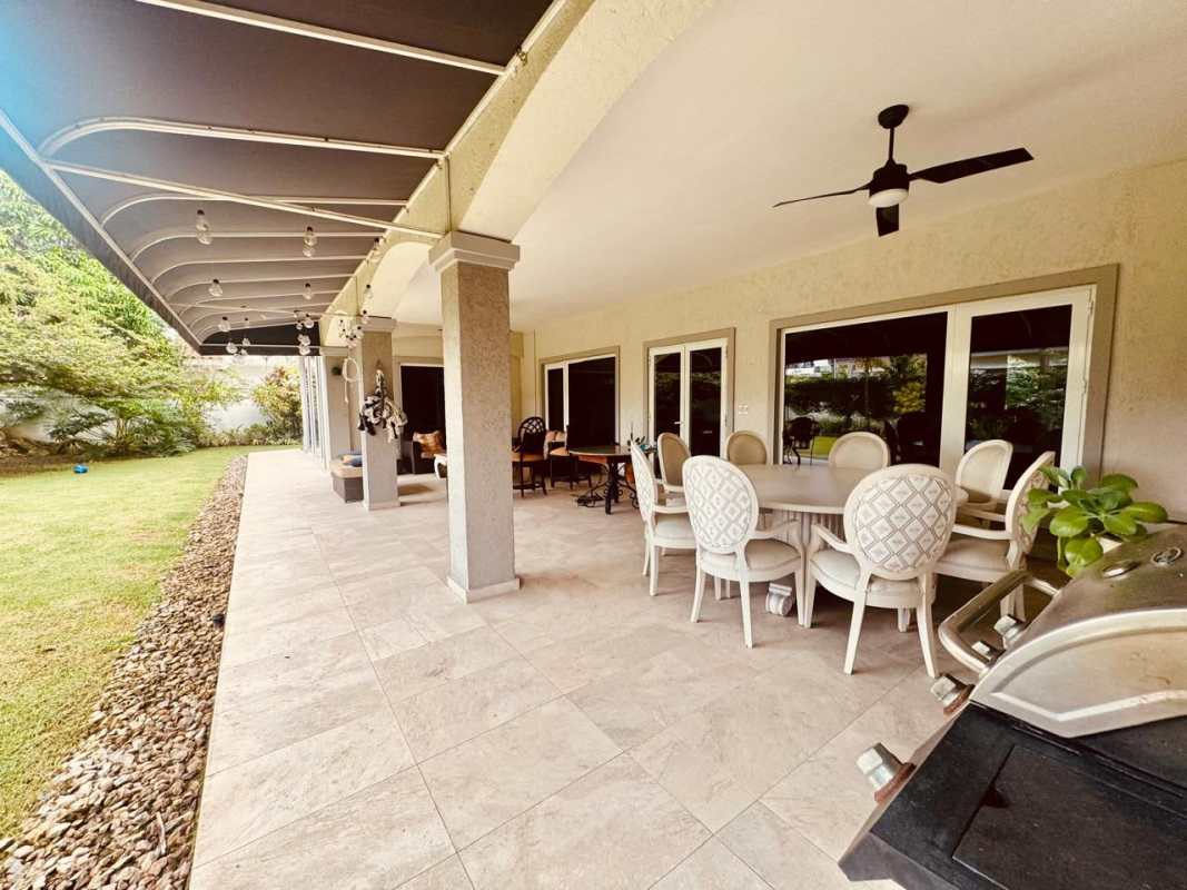 Designer kitchen featuring granite countertops, high-end appliances, and island in Costa del Este luxury house