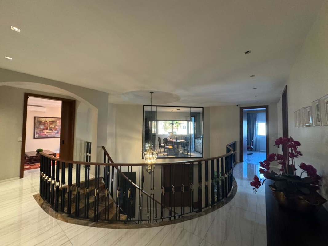 Spacious covered terrace with dining area and landscaped garden corner villa Royal Pacific Costa del Este Panama