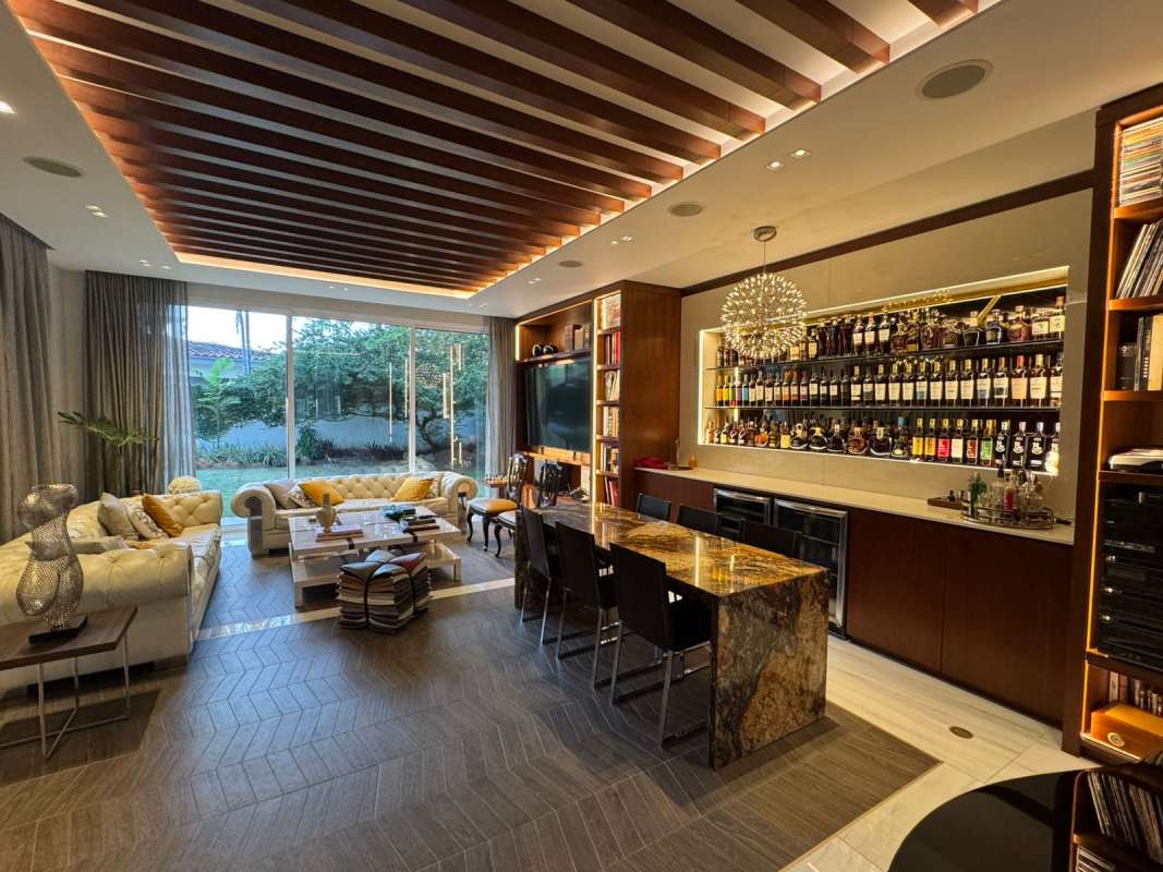 Elegant living room with marble floors, bar area, and floor-to-ceiling windows Royal Pacific Costa del Este Panama