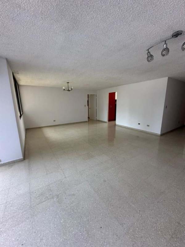 Large living area with city views through windows in PH Diamond Tower Obarrio Panama City