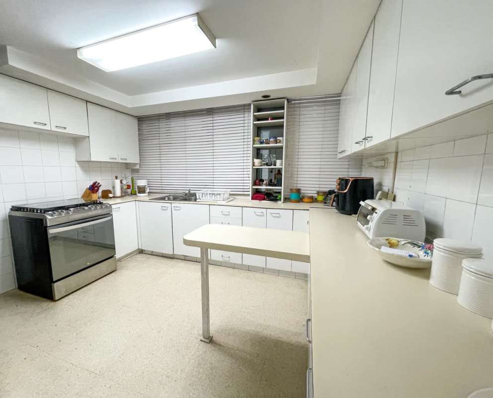 Bright modern kitchen with tile counters and ample cabinetry Punta Paitilla apartment