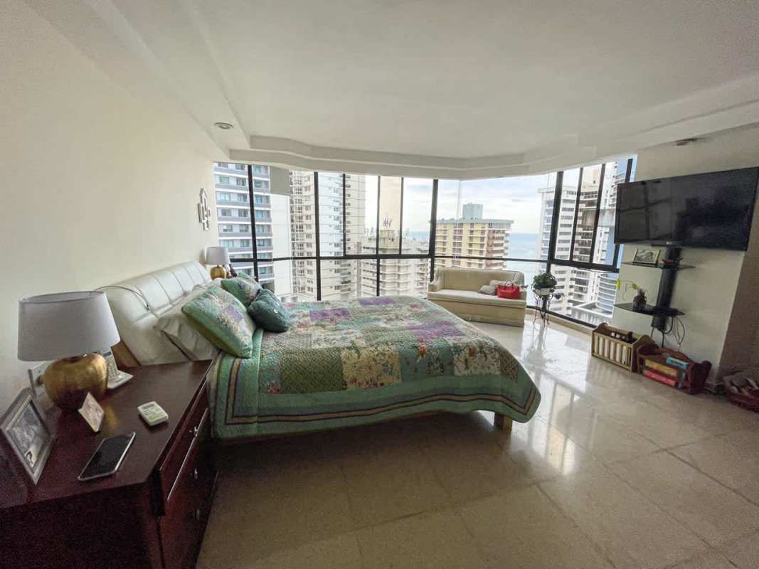 Large walk-in closet with organized shelving and drawers in Punta Paitilla condo