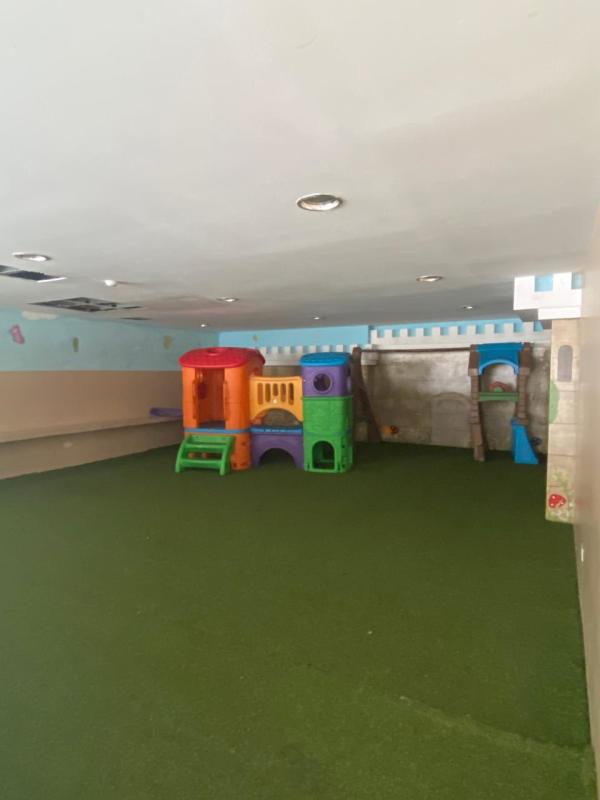 Kids indoor playground with play structures and grass flooring PH Torre 88