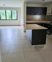 Modern open kitchen and dining room with island River Valley Panamá Pacífico