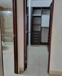 Master walk-in closet with built-in cabinets and bath River Valley Panama Pacifico