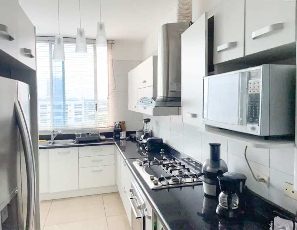 Modern kitchen with granite countertops and appliances PH Vista Balboa Panama City