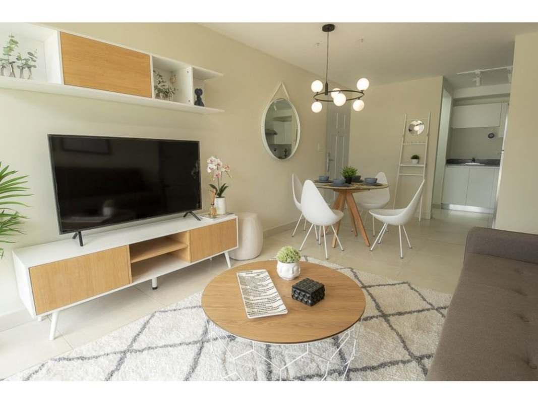 Open concept living dining room with access to balcony PH Panama Viejo Tower 7 Panama