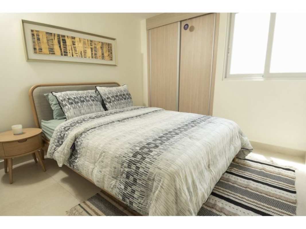 Secondary minimalist bedroom with large window and closet PH Panama Viejo Tower 7 Panama