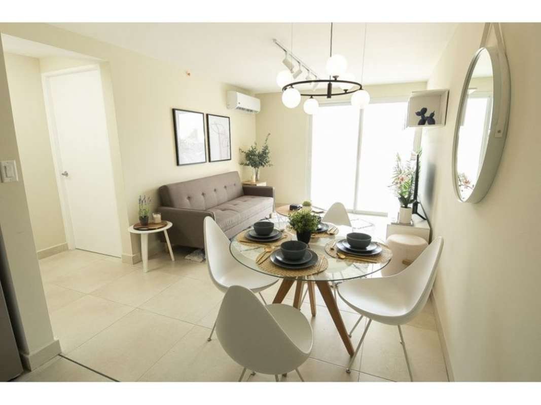 Minimalist bedroom with sliding closet doors large window PH Panama Viejo Tower 7 Panama