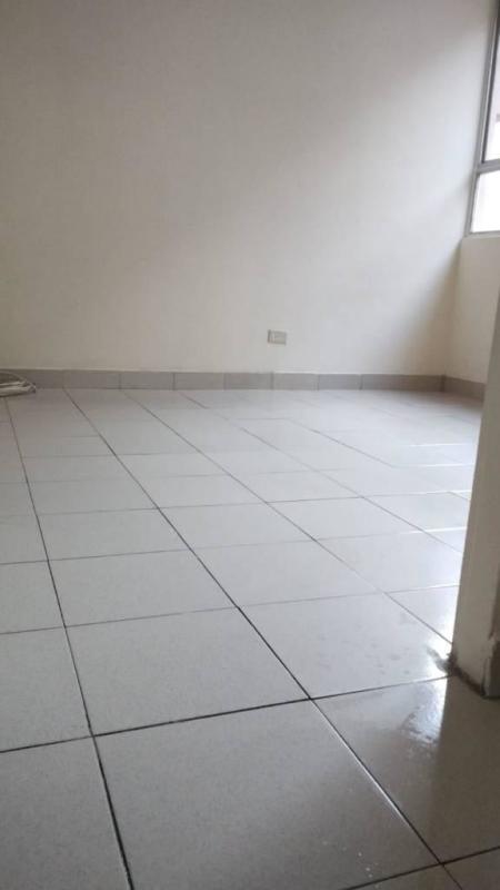 Empty bedroom with natural light ceramic tiled floor Villa del Carmen Panama City
