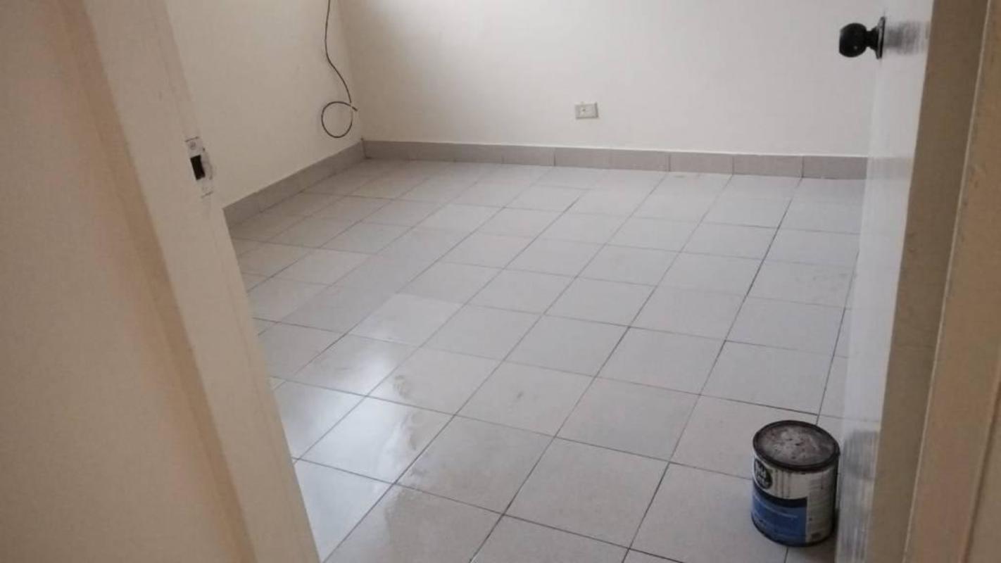 Bright bedroom ceramic tiles white walls Panama City Villa del Carmen