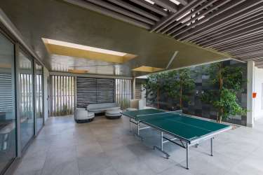 Panama Pacifico apartment building with swimming pool and greenery