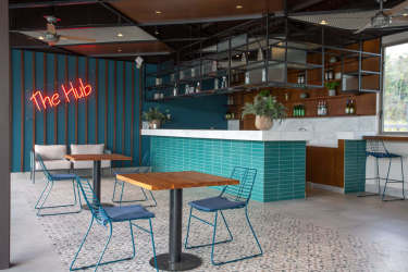 Trendy café lounge area with turquoise tiles in River Valley Panama Pacifico