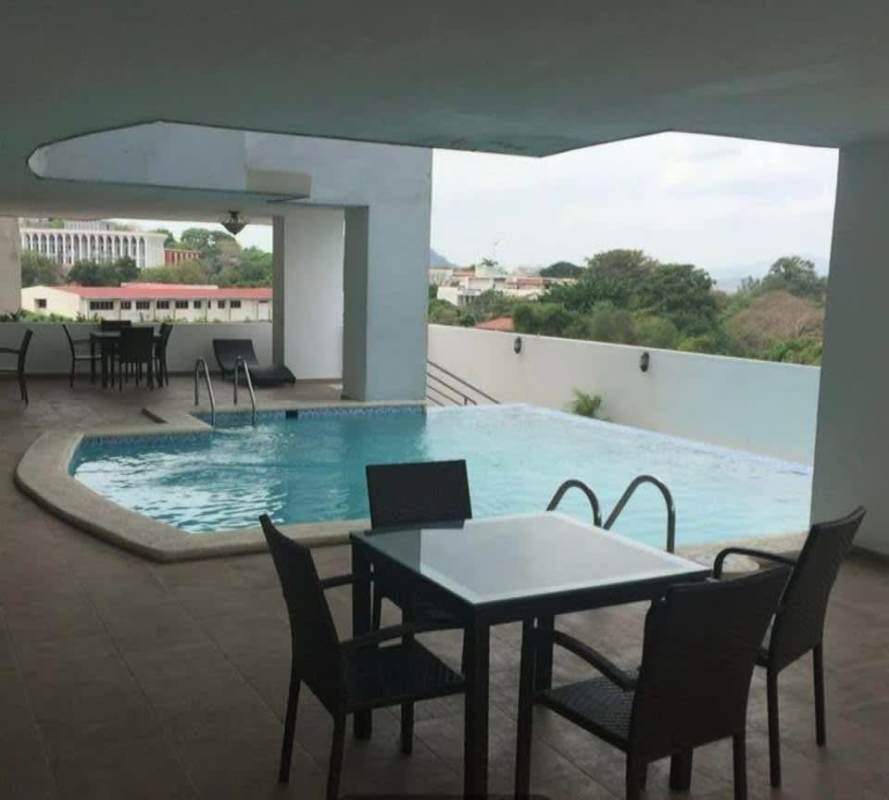 Outdoor swimming pool with seating in PH Dalí El Cangrejo Panama City