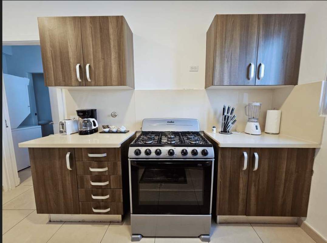 Large balcony with glass railing overlooking Pacific Ocean in PH Oasis on the Bay Panama City