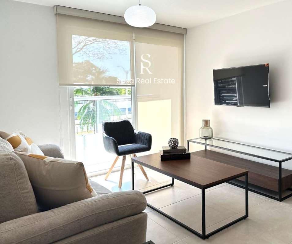 Bright furnished living area with neutral tones in Parque Lefevre Residences Panama