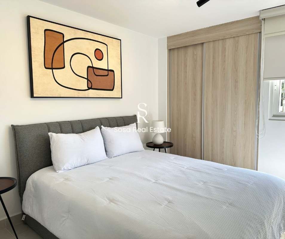 Bedroom with built-in closet and neutral decor Parque Lefevre Panama