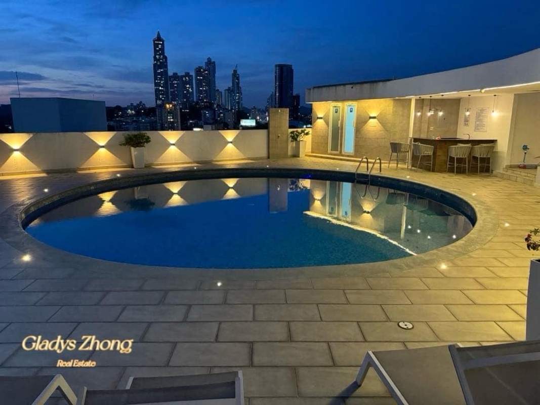 Rooftop swimming pool area with city view and lighting at PH Elmare Plaza Edison Panama