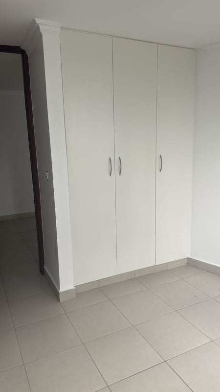 Bedroom with built-in closet and large window PH Metro Tower Panama City