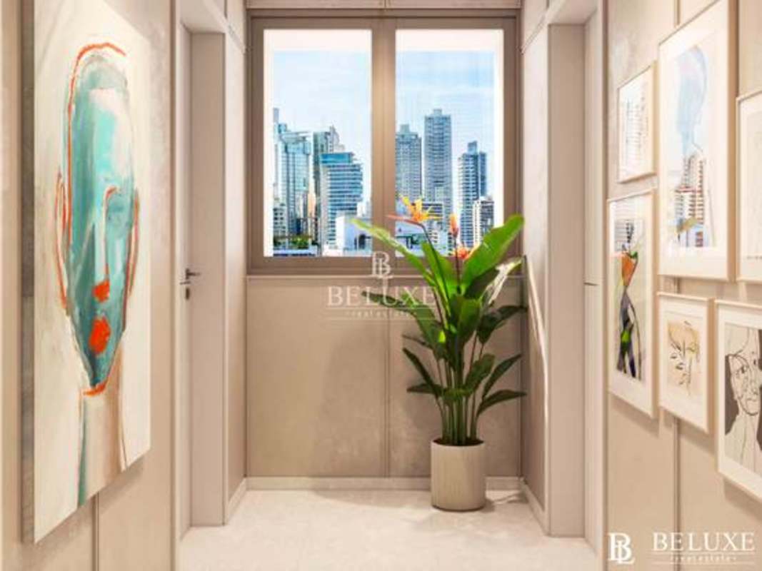 Bedroom with open wardrobe and city views at PH Alive Panama