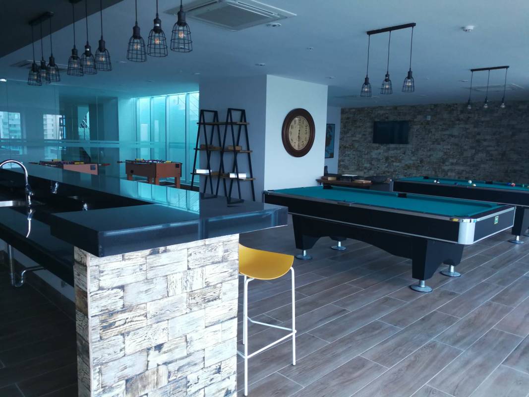 Game lounge with foosball, billiards tables and lounge seating PH Elite 500 Pacific Hills Panama City