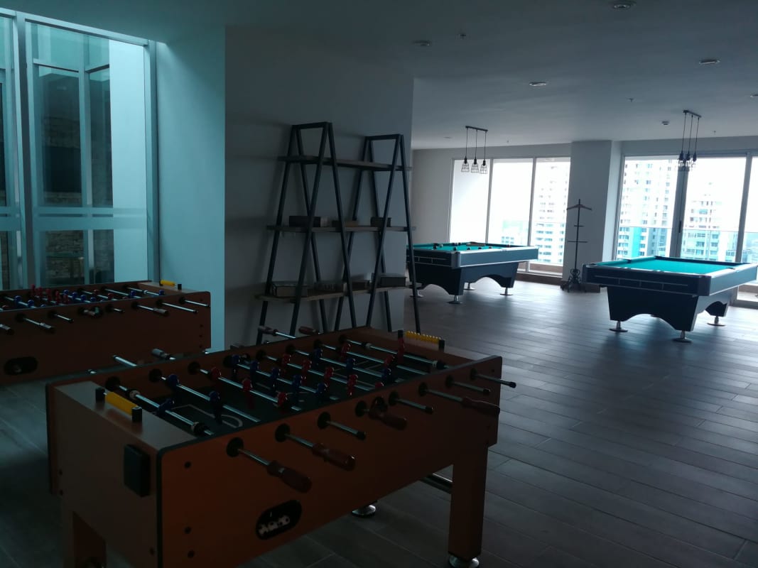 Game lounge with panoramic windows city view billiards and foosball PH Elite 500 Pacific Hills Panama