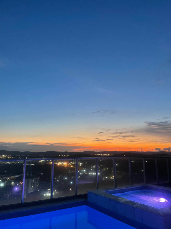 Rooftop pool glass railing skyline and mountains view PH La Cresta condo Bella Vista Panama rent