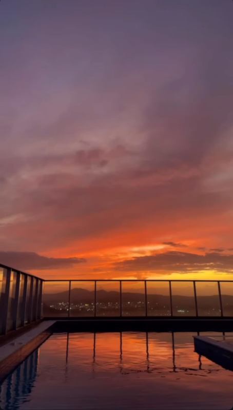 Rooftop pool illuminated jacuzzi skyline sunset PH La Cresta apartment Panama for rent