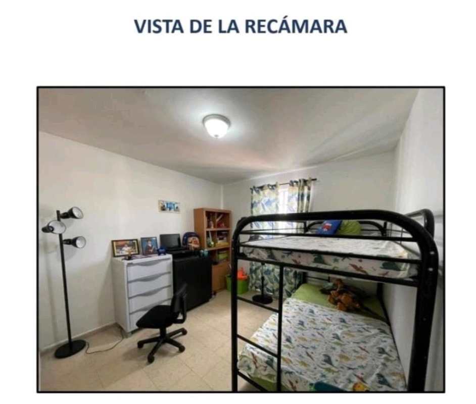 Bedroom with bunk beds and window at PH Altos de la Primavera Panama City