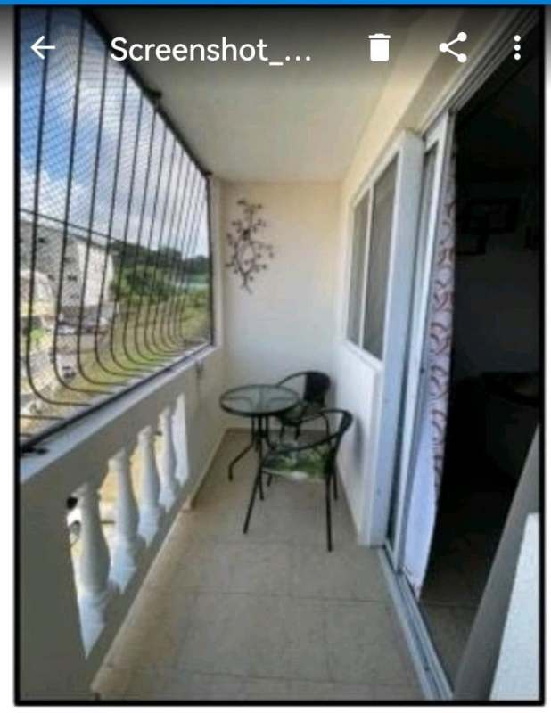 Open living and dining room with tile floors and natural light in PH Altos de la Primavera El Crisol