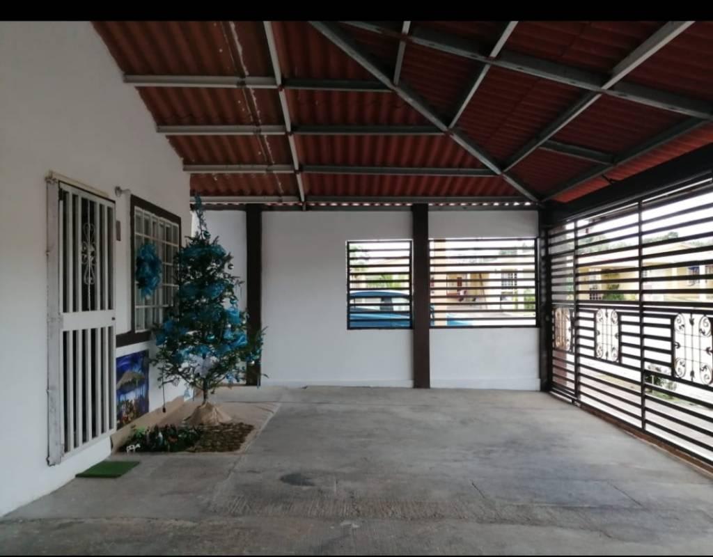 Empty bedroom beige floor white walls and window Villa Verona house Panama