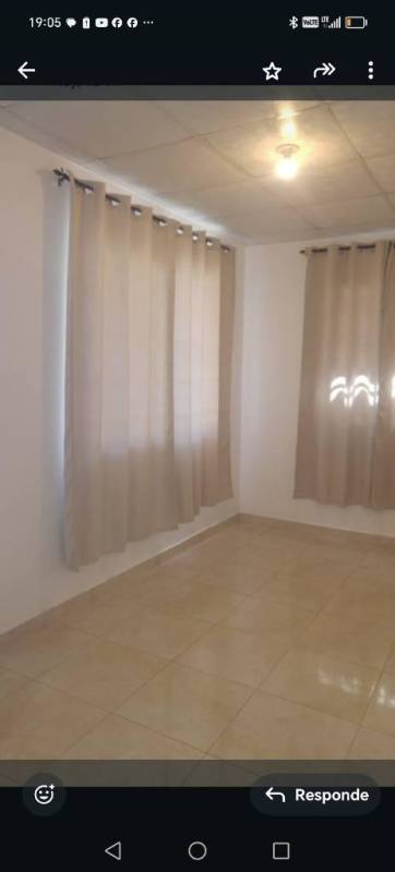 Bedroom with beige tile floors and ceiling light Villa Verona house Panama 24 de Diciembre