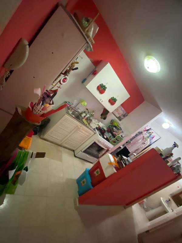 Apartment building with parking area full of cars in 12 de Octubre district Panama City