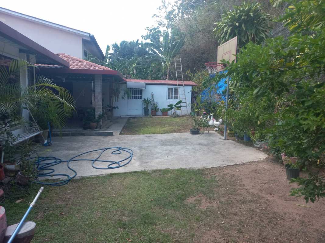 Spacious traditional dining room with wood table and chandelier in Villa Zaita home Panama