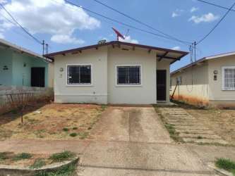 Night view of affordable single story house with driveway and front yard Costa Oeste Valparaíso Panama