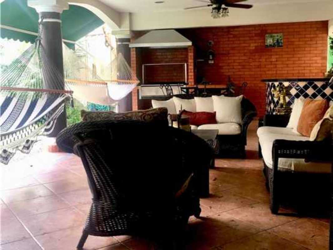 Terrace outdoor patio with furniture, barbecue and hammocks in PH Costa Bay Panama