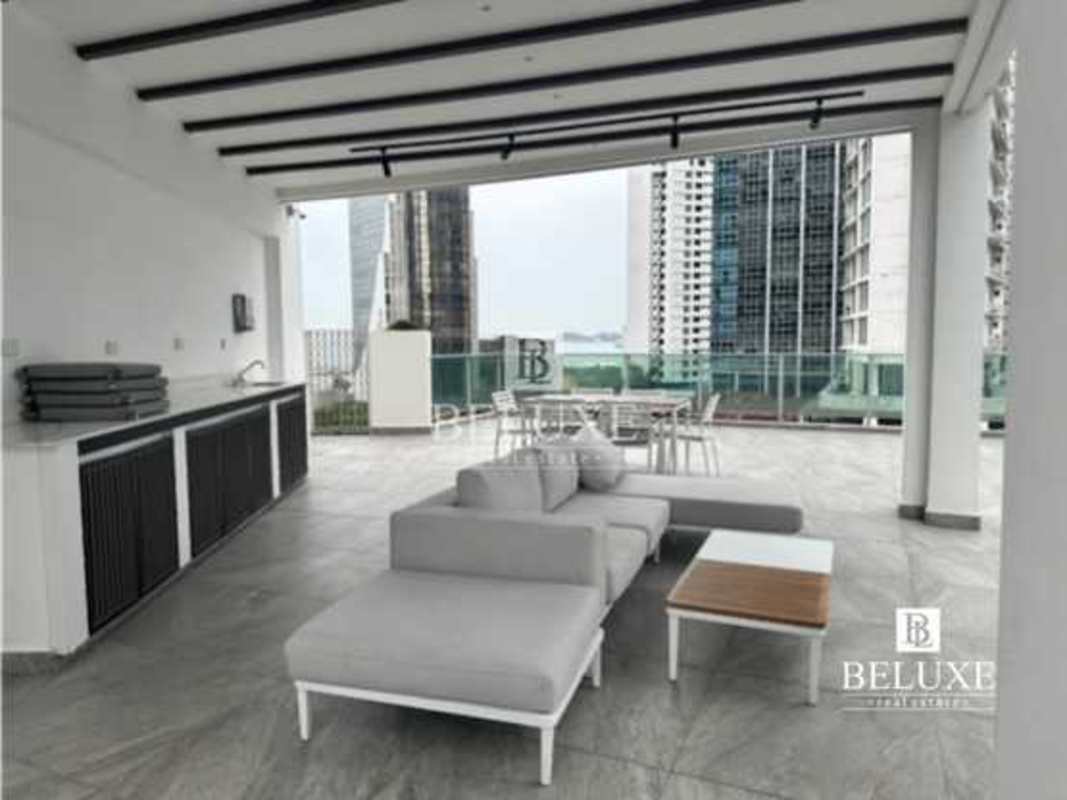 Covered outdoor terrace with BBQ seating area skyline views Allure Bella Vista