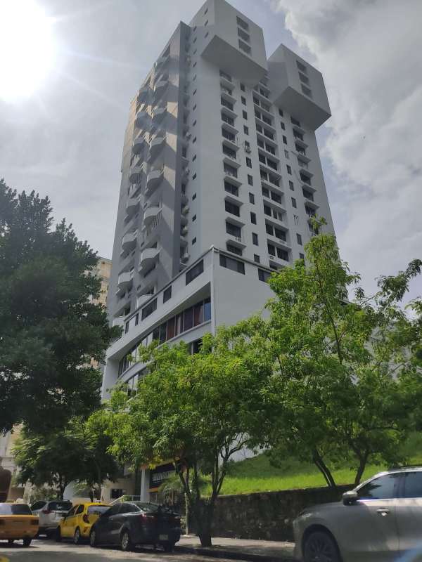 Street level view of PH Cristal Park in Via Argentina with sidewalk and landscaping
