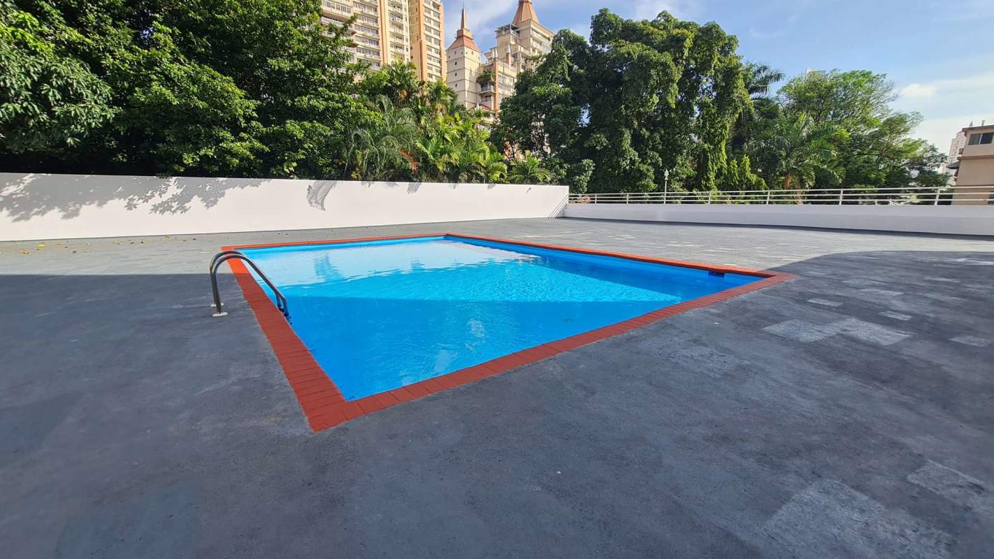 Swimming pool with deck and skyline views in PH Cristal Park Panama