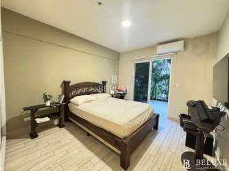 Child-friendly bedroom with bunk bed, AC, and garden views at Playa Caracol apartment