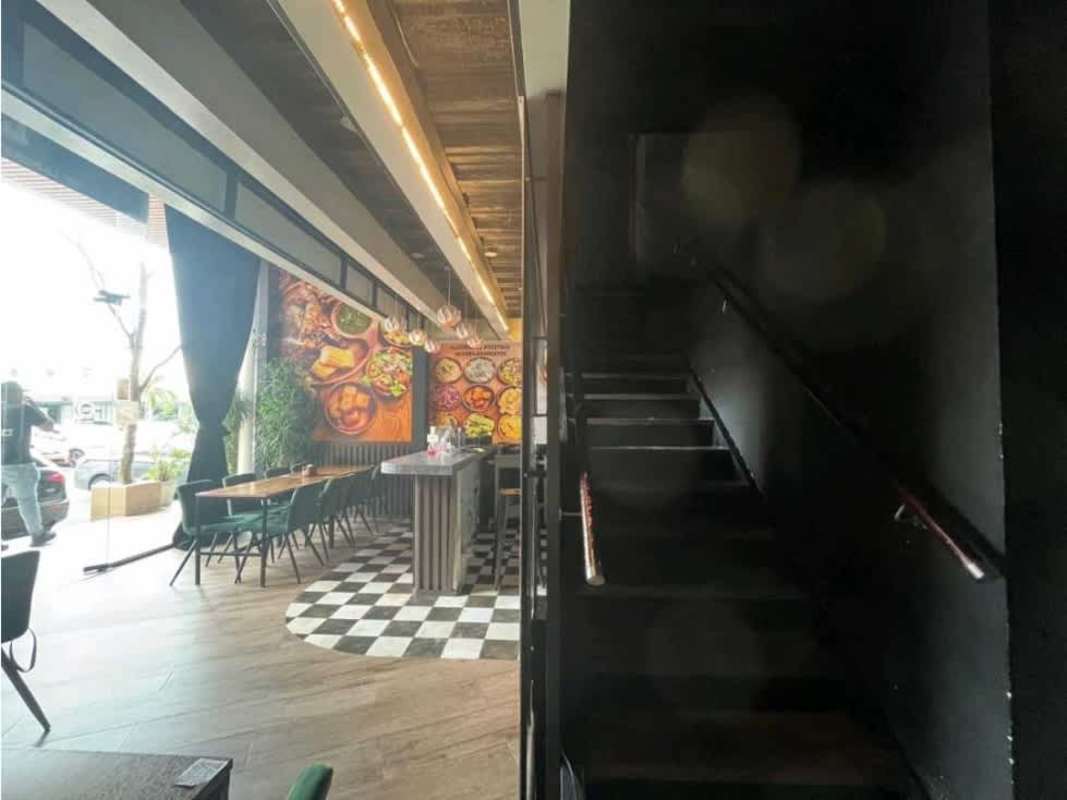 Restaurant dining room large windows checkered floor pendant lights mural PH Plaza 50 Panama