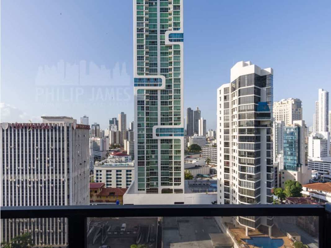 Compact modern kitchenette with granite countertop, wood cabinets in PH The Gray apartment for sale Panama City