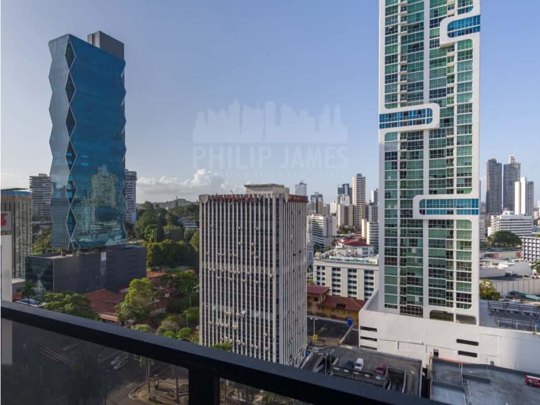 Modern minimalist bathroom with marble tiles, shower, and sleek vanity PH The Gray Panama City
