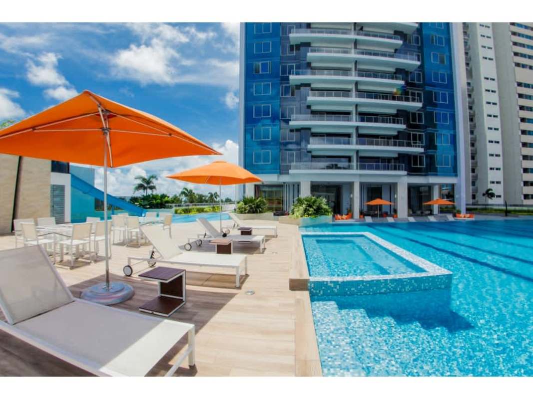 Outdoor pool with umbrellas and skyline in PH Regalia luxury condo Panama
