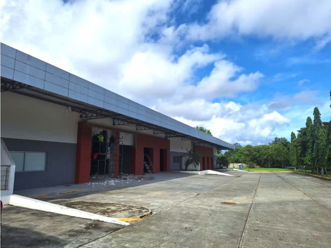 Modern warehouse exterior with wide concrete driveway at Tocumen Storage Complex Panama