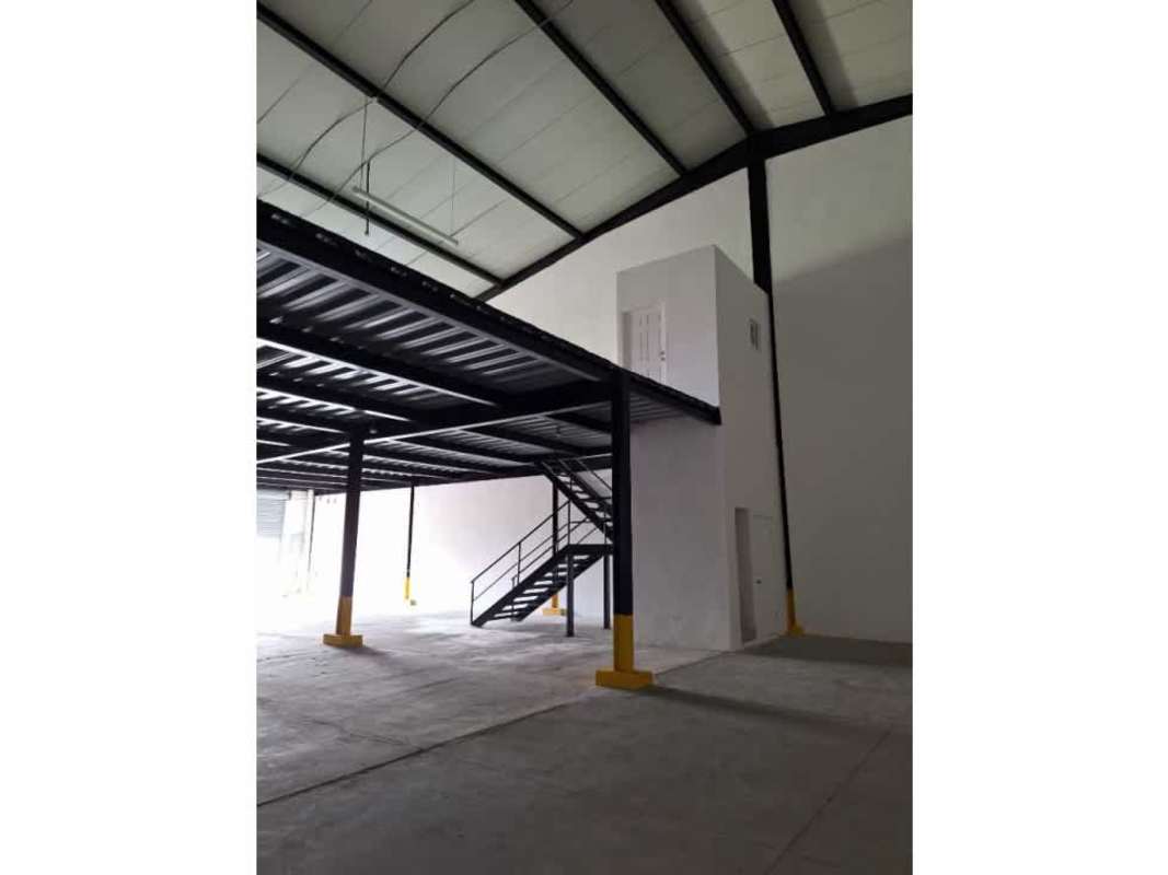 Spacious interior of warehouse with metal mezzanine and concrete floors in Parque Industrial Las Americas Pacora Panama