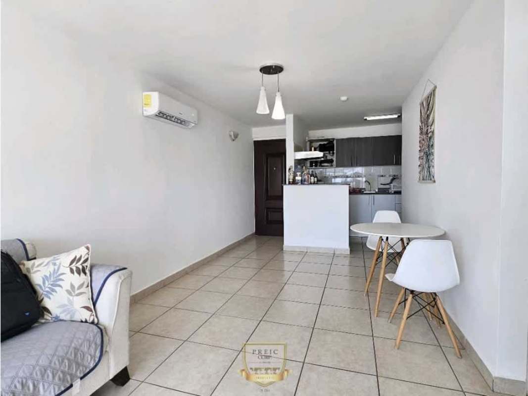 Simple bedroom with large windows, built-in wardrobe, and white tile floors in PH Prisma Panama