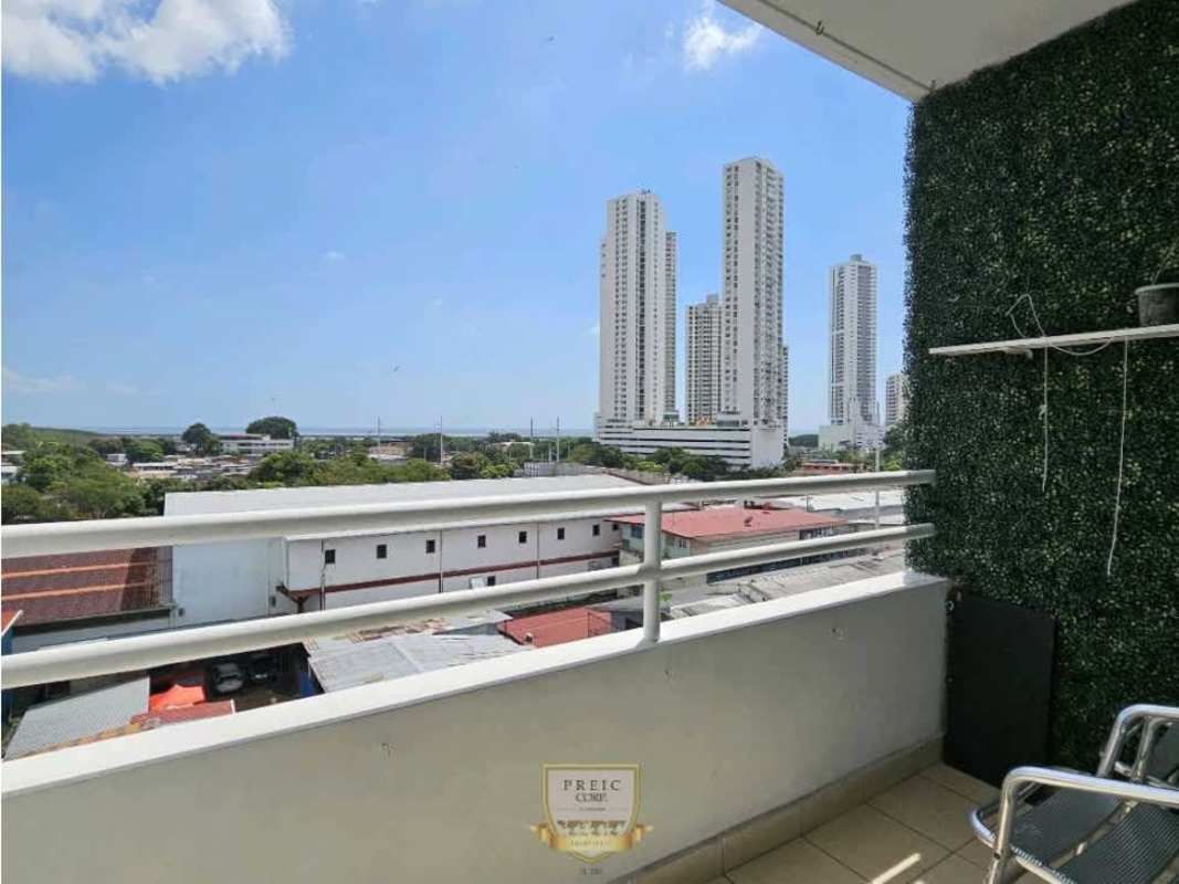 Compact living dining space with open kitchen and minimalist white decor in PH Prisma Panama